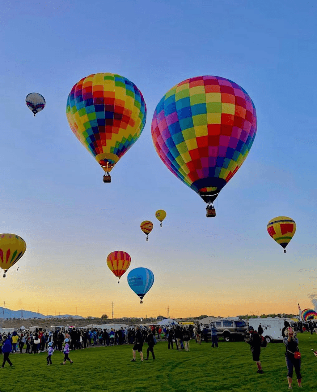 Colorful hot air balloons launching at sunrise during the Walla Walla Balloon Stampede, a premier spring event near The GG Mansion & Inn.